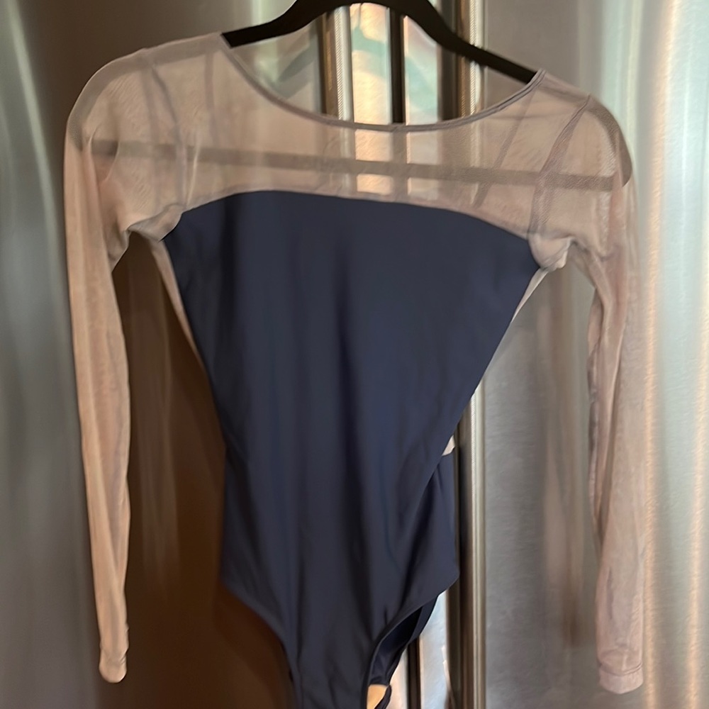 Blue long sleeve Eleve leo with slight design on the mesh sleeves.